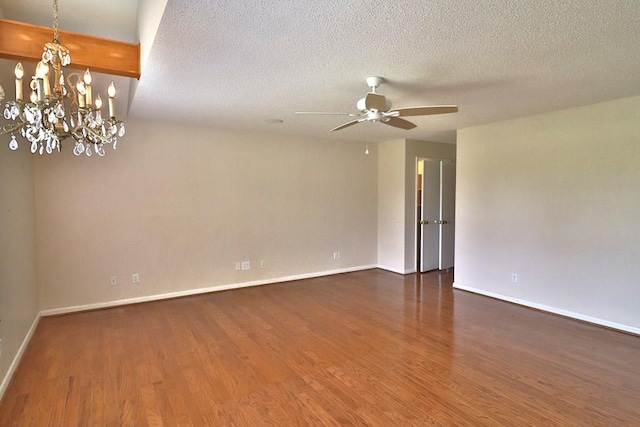 1222 E Main St, Ariton, AL 36311 - empty room featuring ceiling fan, wood finished floors, a chandelier, and a textured ceiling