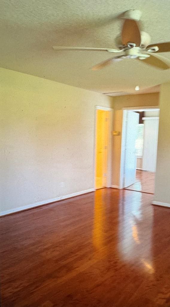1222 E Main St, Ariton, AL 36311 - spare room featuring ceiling fan and wood finished floors