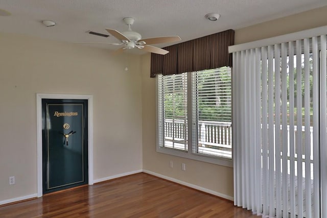 1222 E Main St, Ariton, AL 36311 - spare room with wood finished floors, ceiling fan, and a textured ceiling