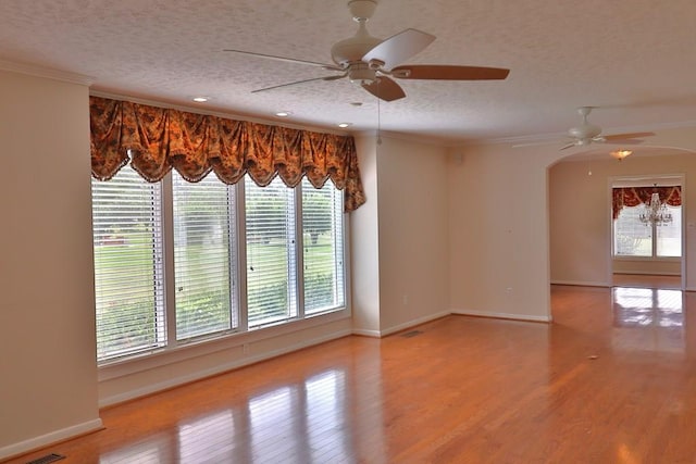 1222 E Main St, Ariton, AL 36311 - unfurnished room with a ceiling fan, a textured ceiling, arched walkways, wood finished floors, and recessed lighting