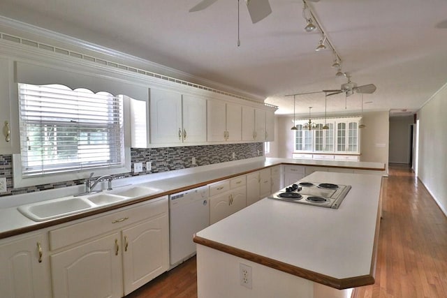 1222 E Main St, Ariton, AL 36311 - kitchen featuring a ceiling fan, electric stovetop, white dishwasher, decorative backsplash, and a kitchen island