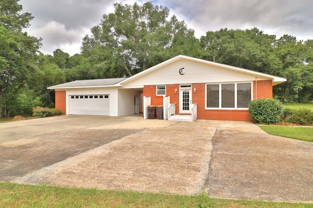 1222 E Main St, Ariton, AL 36311 - ranch-style home featuring driveway, a garage, and brick siding
