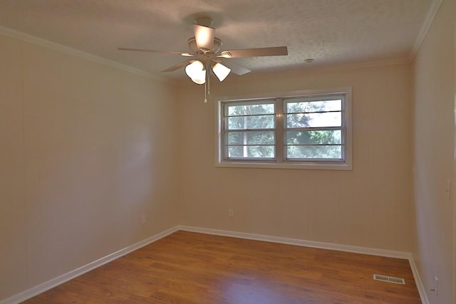 1222 E Main St, Ariton, AL 36311 - unfurnished room featuring a ceiling fan, wood finished floors, and crown molding
