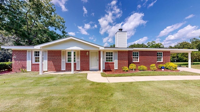 ranch-style home with a front lawn, a porch, and a carport