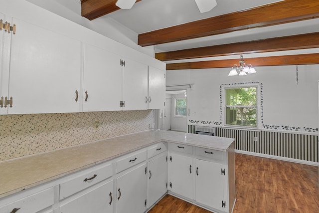 1104 Valley Forge Rd, Dothan, AL 36301 - kitchen featuring beamed ceiling, backsplash, light countertops, wood finished floors, and white cabinets