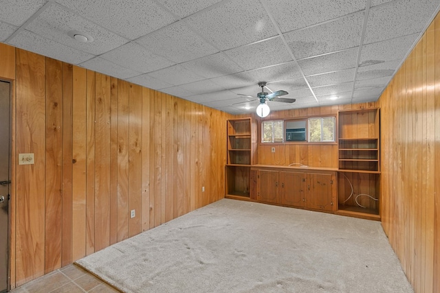 1104 Valley Forge Rd, Dothan, AL 36301 - unfurnished living room with wooden walls, ceiling fan, carpet flooring, a drop ceiling, and cooling unit