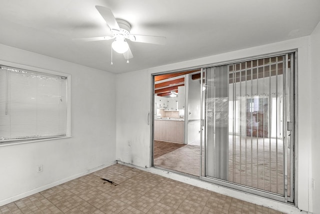1104 Valley Forge Rd, Dothan, AL 36301 - empty room featuring tile patterned floors, ceiling fan, and baseboards