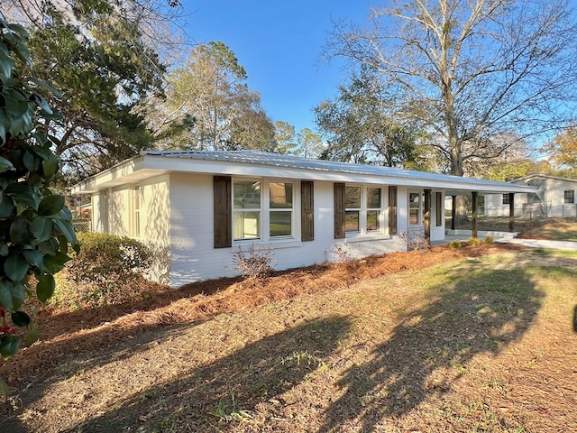 view of front of house with metal roof