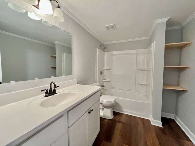 bathroom featuring visible vents, toilet, washtub / shower combination, vanity, and wood finished floors