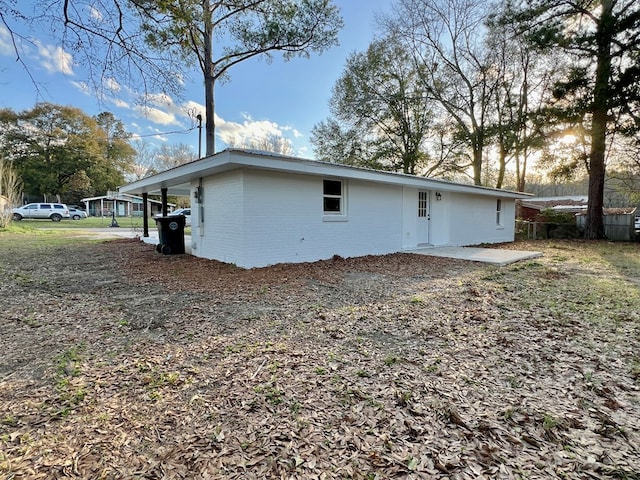 exterior space with brick siding