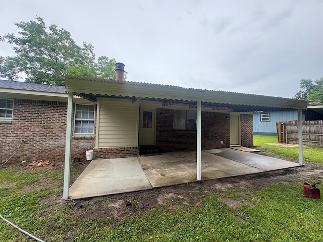1905 Shamrock Rd, Dothan, AL 36301 - back of house with brick siding and a patio area