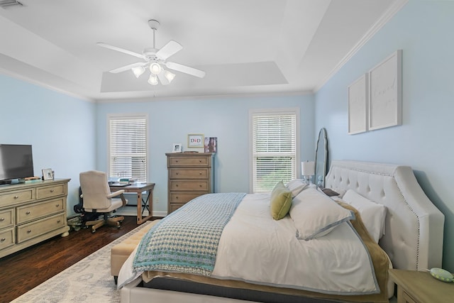 538 Orchard, Dothan, AL 36305 - bedroom with dark wood-style floors, crown molding, a tray ceiling, multiple windows, and an office area