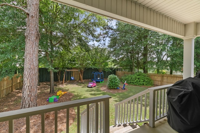 538 Orchard, Dothan, AL 36305 - wooden deck with a playground, area for grilling, and a fenced backyard