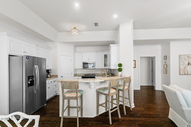 538 Orchard, Dothan, AL 36305 - kitchen with appliances with stainless steel finishes, a peninsula, crown molding, white cabinetry, and a breakfast bar