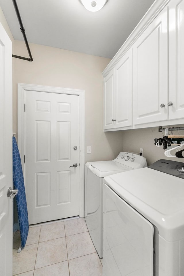 538 Orchard, Dothan, AL 36305 - laundry room with separate washer and dryer, cabinet space, and light tile patterned floors