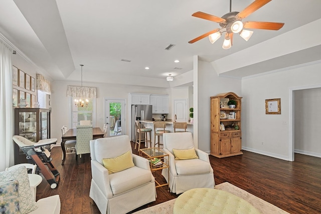 538 Orchard, Dothan, AL 36305 - living area featuring a chandelier, dark wood finished floors, ceiling fan, recessed lighting, and a tray ceiling