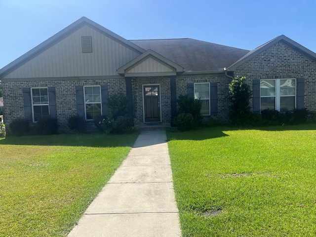 101 Brattleboro Ct, Dothan, AL 36301 - ranch-style home featuring brick siding, a front yard, and a shingled roof