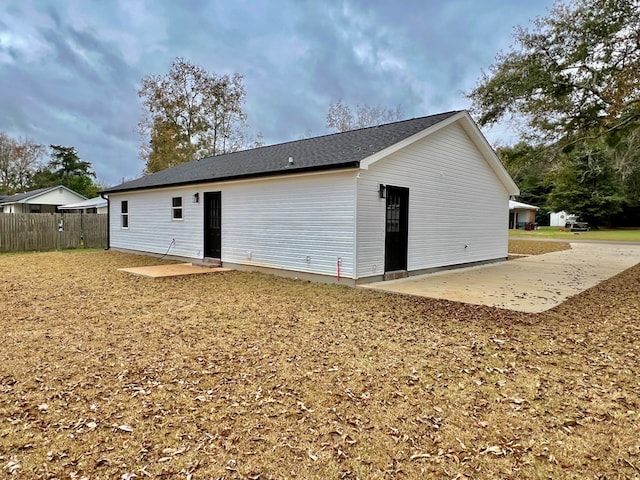 back of property with a patio