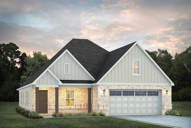 view of front facade featuring a lawn and a garage