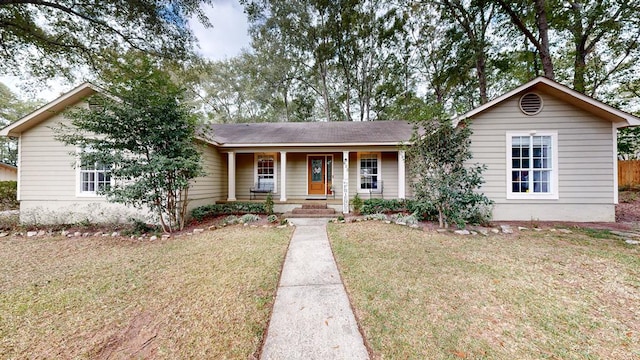 ranch-style house with a porch and a front lawn