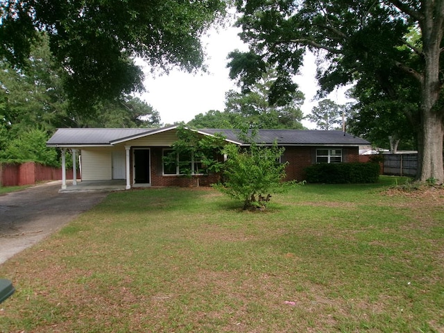 202 Cardinal Ln, Enterprise, AL 36330 - ranch-style house with a carport, driveway, a metal roof, and brick siding