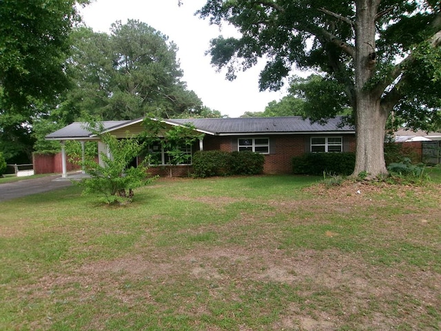 202 Cardinal Ln, Enterprise, AL 36330 - ranch-style house with an attached carport, brick siding, a metal roof, and driveway