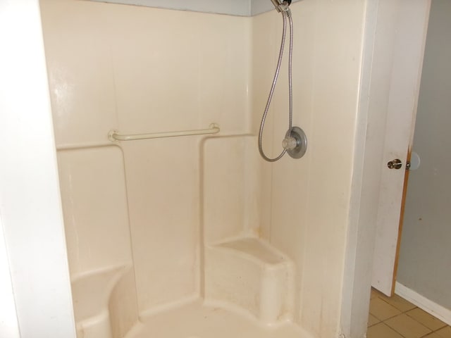 202 Cardinal Ln, Enterprise, AL 36330 - full bathroom featuring tile patterned floors and a shower