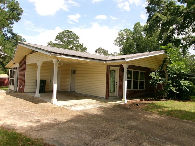 202 Cardinal Ln, Enterprise, AL 36330 - single story home featuring driveway, a carport, and a metal roof