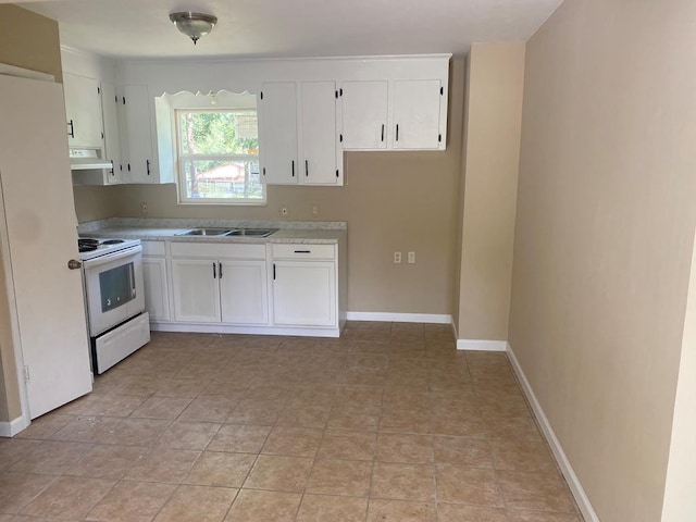 kitchen featuring white cabinets, white appliances, light stone counters, and sink