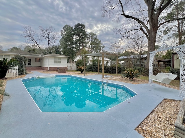 view of swimming pool featuring a fenced in pool, a patio area, fence, and a pergola