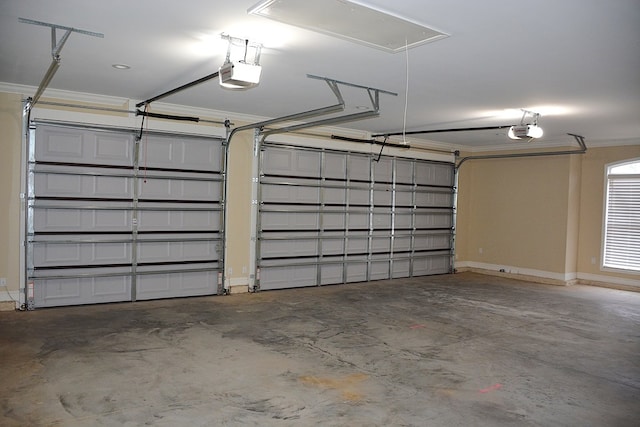 garage featuring baseboards and a garage door opener