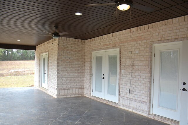 view of patio featuring french doors and a ceiling fan