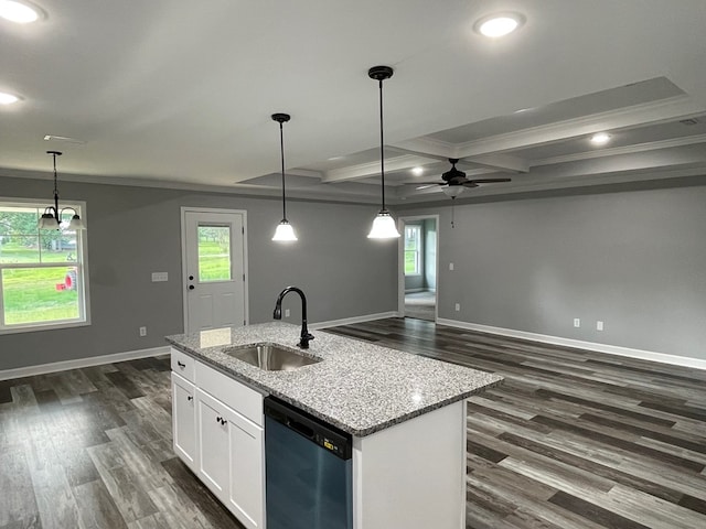 kitchen featuring dark wood-type flooring, dishwashing machine, white cabinets, and a sink