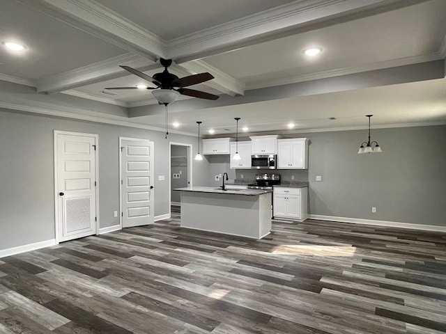 kitchen with crown molding, white cabinetry, sink, and a kitchen island with sink