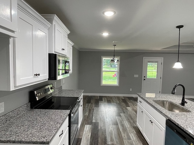 kitchen featuring dark wood finished floors, white cabinetry, stainless steel appliances, and a sink