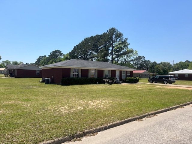 301 Terrace Dr, Headland, AL 36345 - ranch-style house featuring central AC unit and a front lawn