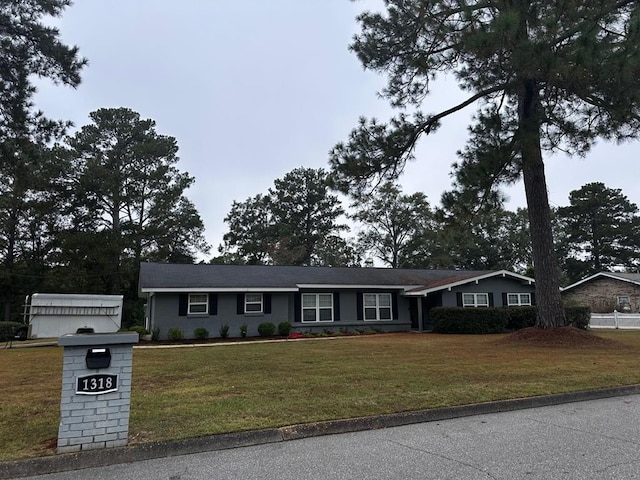 ranch-style home with a front yard