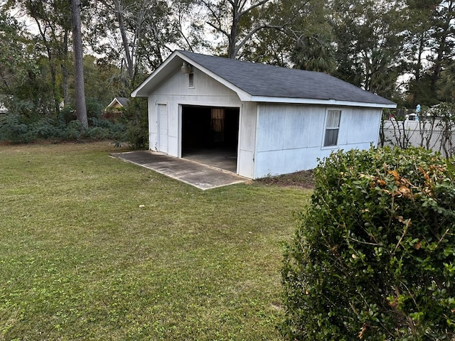 view of outbuilding with a lawn