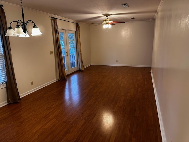 spare room featuring french doors, ceiling fan with notable chandelier, dark hardwood / wood-style floors, and ornamental molding