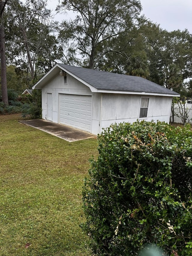 garage with a yard