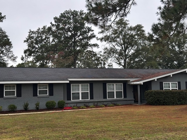 ranch-style house with a front lawn