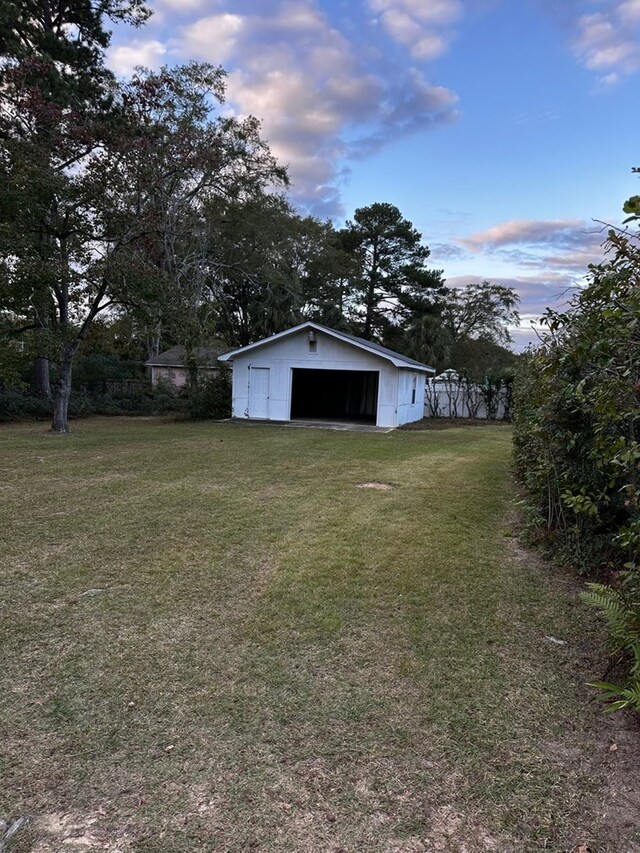 yard at dusk with an outdoor structure