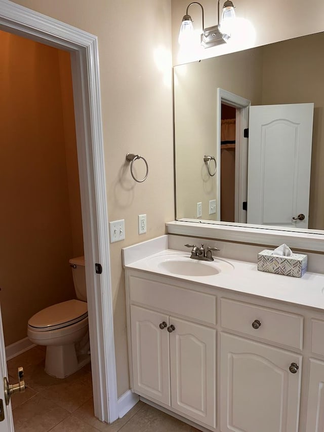 210 Petersburg Ct, Dothan, AL 36301 - bathroom with toilet, baseboards, tile patterned floors, and vanity