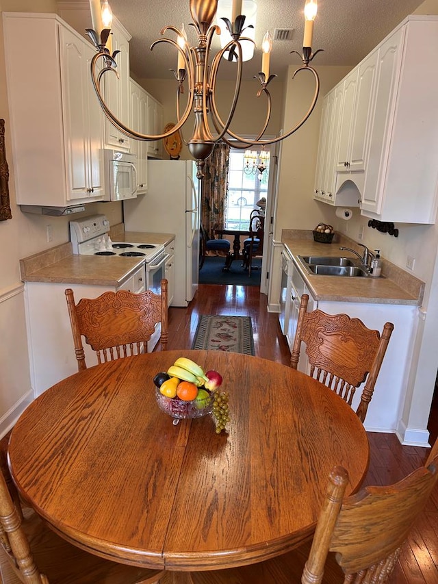 210 Petersburg Ct, Dothan, AL 36301 - dining space with baseboards, an inviting chandelier, visible vents, and dark wood-type flooring