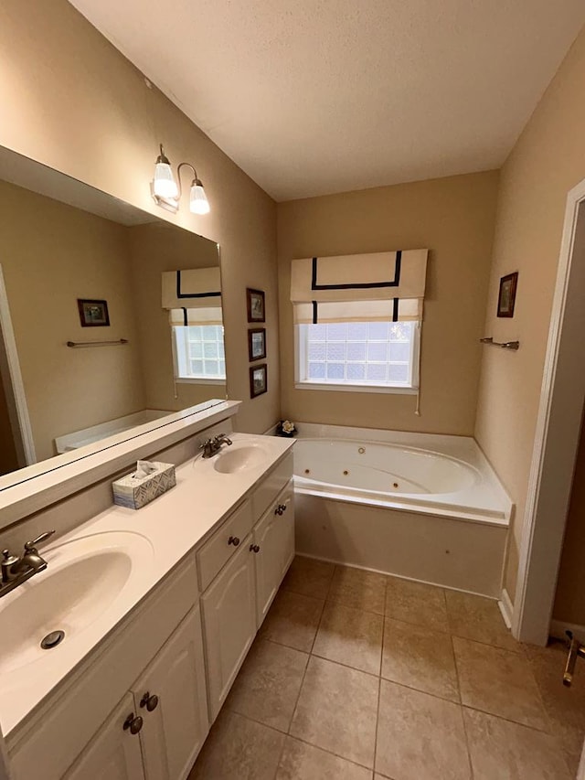 210 Petersburg Ct, Dothan, AL 36301 - full bath with tile patterned flooring, a sink, double vanity, and a jetted tub