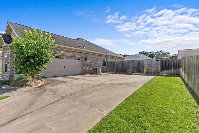 125 Hayley Dr, Enterprise, AL 36330 - view of property exterior featuring brick siding, driveway, a garage, and a shingled roof