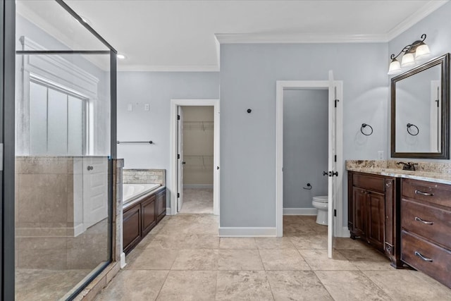 125 Hayley Dr, Enterprise, AL 36330 - full bathroom with ornamental molding, a garden tub, vanity, a walk in closet, and a stall shower
