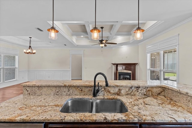 125 Hayley Dr, Enterprise, AL 36330 - kitchen featuring ornamental molding, ceiling fan, coffered ceiling, open floor plan, and decorative light fixtures