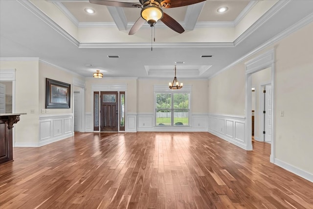 125 Hayley Dr, Enterprise, AL 36330 - unfurnished living room featuring light wood-style flooring, crown molding, a chandelier, a ceiling fan, and coffered ceiling