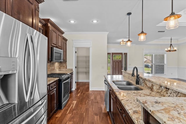 125 Hayley Dr, Enterprise, AL 36330 - kitchen with appliances with stainless steel finishes, crown molding, dark wood-type flooring, recessed lighting, and hanging light fixtures